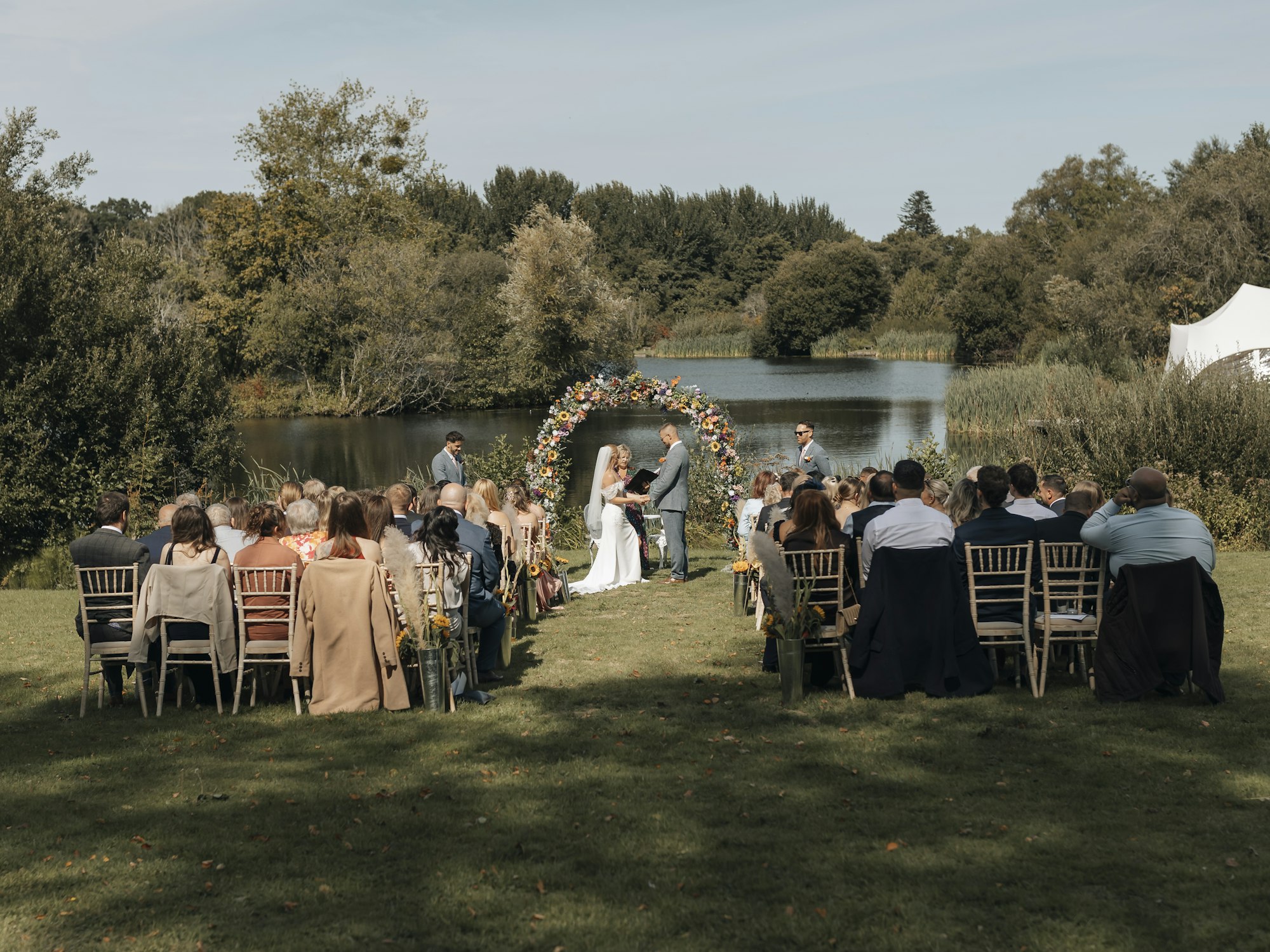 Lakeside wedding ceremony from the back rows